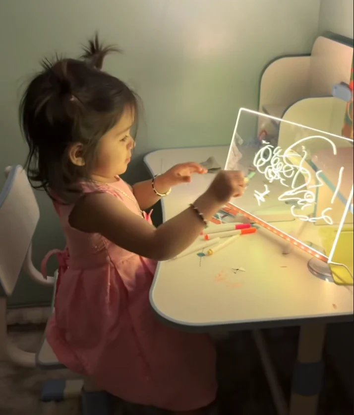 Fatima's daughter drawing on the KidoraX board